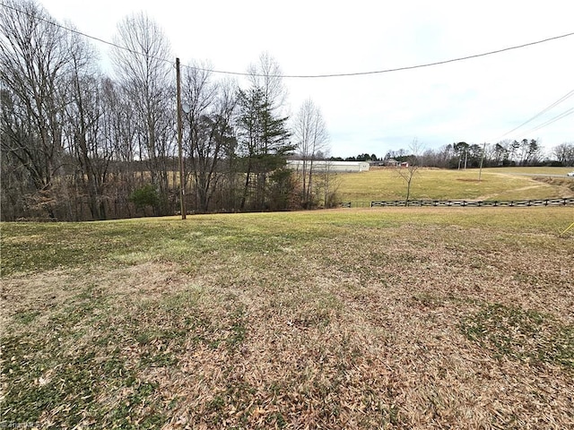 view of yard with a rural view