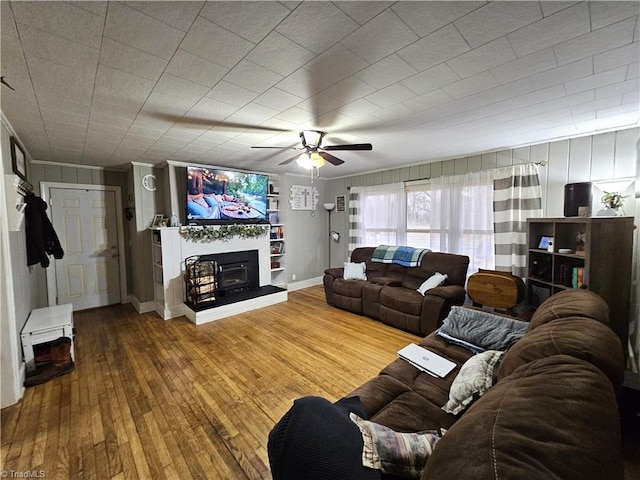 living room with hardwood / wood-style flooring and ceiling fan