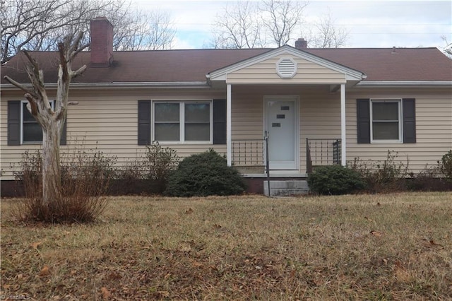 ranch-style house with a front lawn