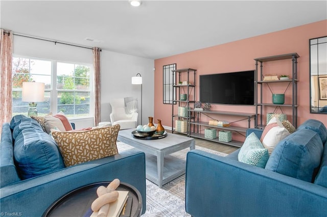 living room with light hardwood / wood-style floors