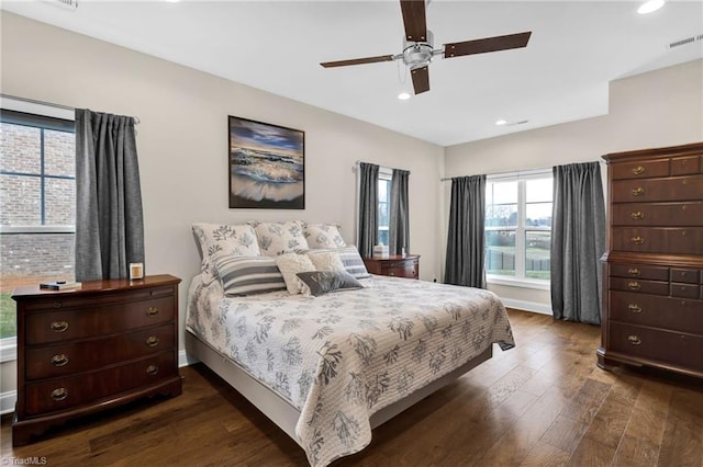 bedroom featuring ceiling fan and dark wood-type flooring