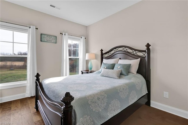 bedroom featuring dark hardwood / wood-style floors