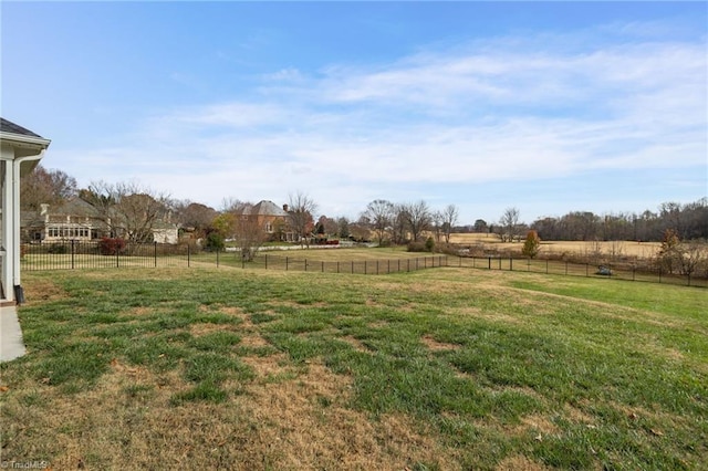 view of yard with a rural view