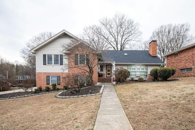 split level home with a front yard