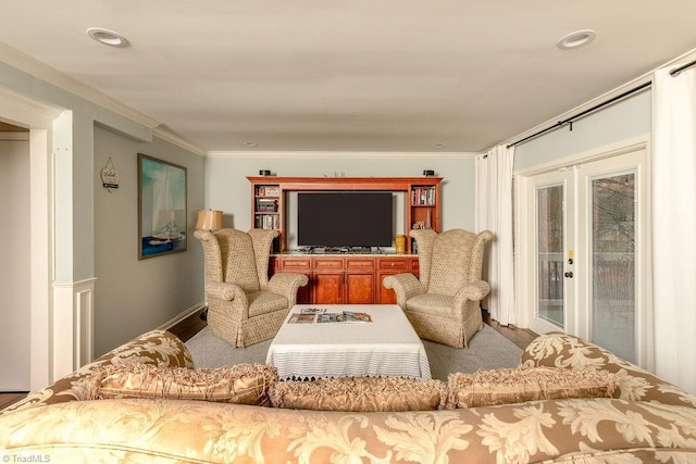 living room with ornamental molding and french doors