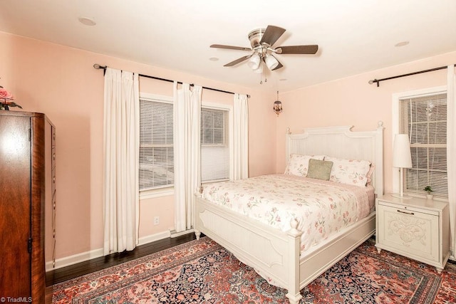 bedroom featuring ceiling fan and dark hardwood / wood-style flooring