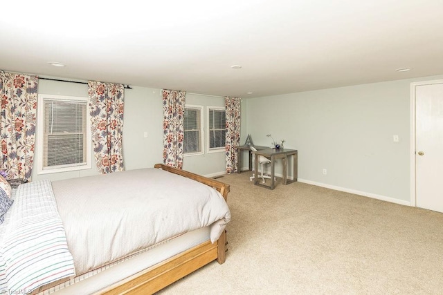 bedroom featuring light carpet