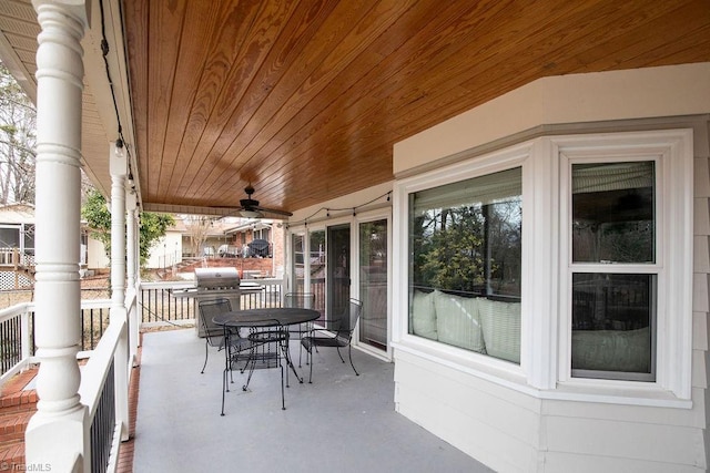 view of patio featuring area for grilling and ceiling fan