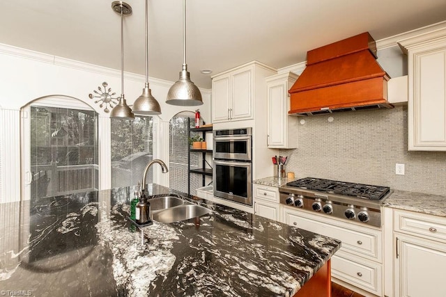 kitchen with premium range hood, sink, ornamental molding, stainless steel appliances, and light stone countertops