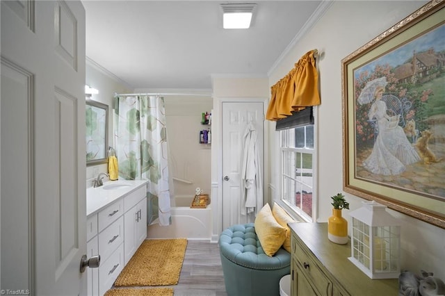 full bath with visible vents, crown molding, wood finished floors, shower / bath combination with curtain, and vanity