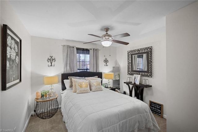 carpeted bedroom with baseboards and a ceiling fan