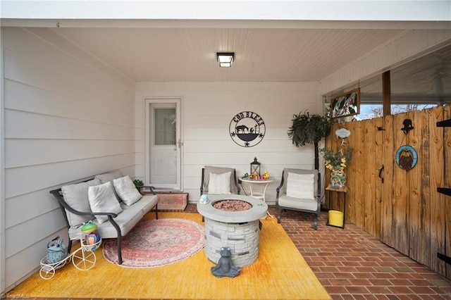 view of patio / terrace featuring an outdoor living space with a fire pit