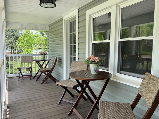 wooden terrace featuring covered porch