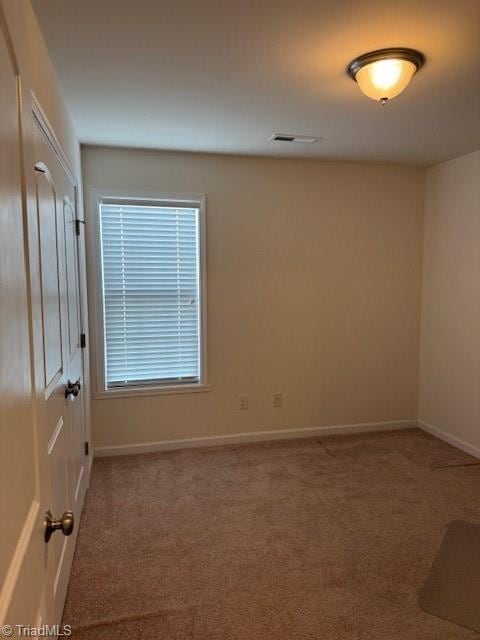 empty room featuring carpet floors