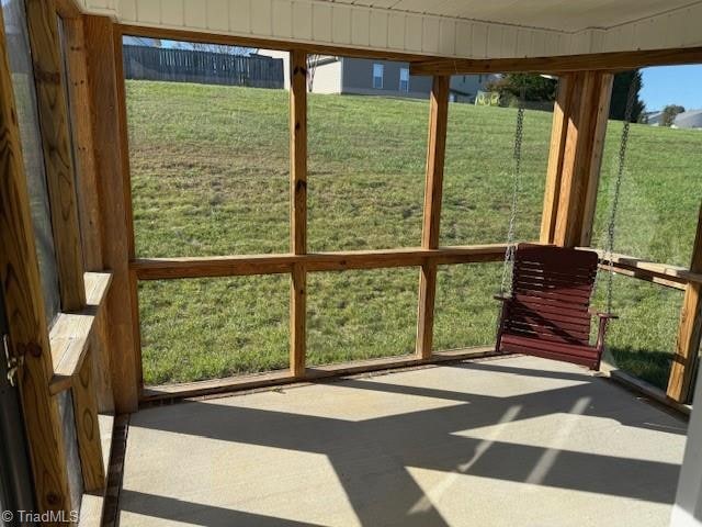 unfurnished sunroom featuring a wealth of natural light