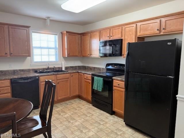 kitchen with sink and black appliances