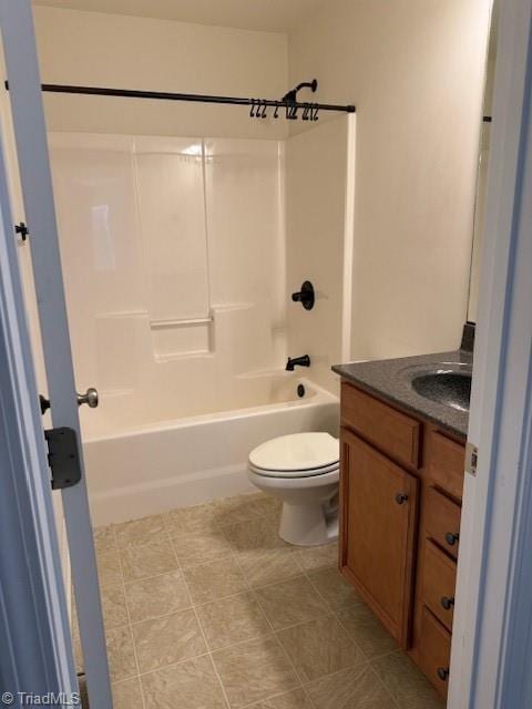 full bathroom featuring tile patterned flooring, shower / bath combination, vanity, and toilet