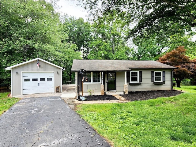 1129 Foxtrot Ct, King, NC 27021 - ranch-style house featuring an outbuilding, a front yard, a garage, and driveway