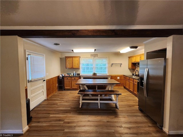 1129 Foxtrot Ct, King, NC 27021 - kitchen featuring stainless steel fridge, a sink, crown molding, wainscoting, and dark wood-style flooring