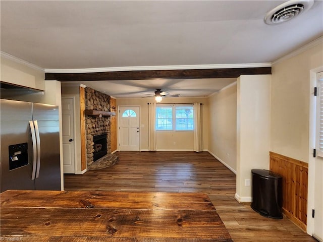 1129 Foxtrot Ct, King, NC 27021 - unfurnished living room featuring crown molding, wood finished floors, a ceiling fan, a fireplace, and a wainscoted wall