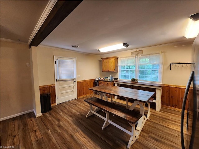 1129 Foxtrot Ct, King, NC 27021 - dining space with a wainscoted wall, crown molding, wood walls, and dark wood-style flooring