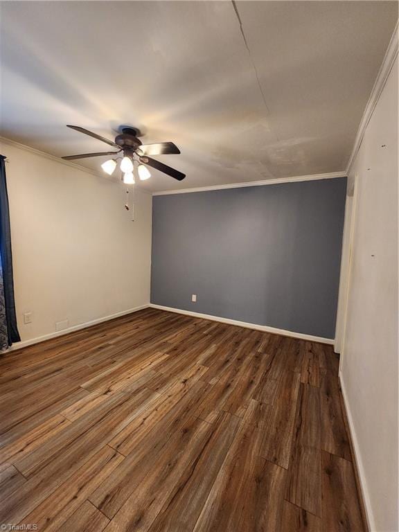 1129 Foxtrot Ct, King, NC 27021 - spare room with a ceiling fan, crown molding, dark wood-style floors, and baseboards