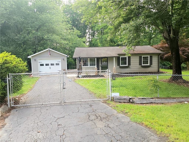 1129 Foxtrot Ct, King, NC 27021 - ranch-style home with a garage, a gate, driveway, and an outdoor structure