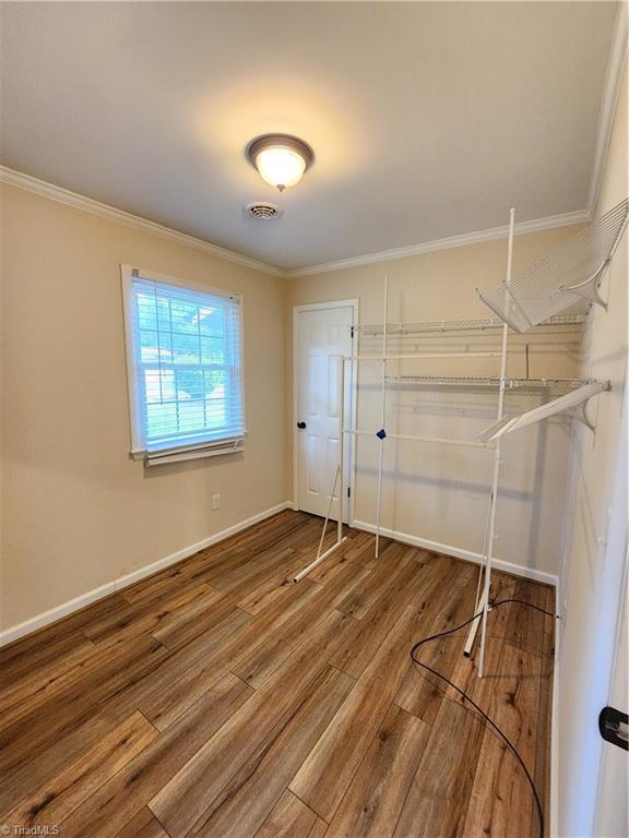 1129 Foxtrot Ct, King, NC 27021 - walk in closet featuring wood finished floors