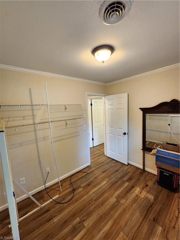 1129 Foxtrot Ct, King, NC 27021 - unfurnished bedroom with wood finished floors, baseboards, and ornamental molding