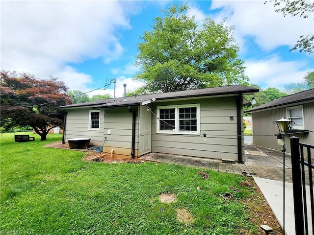1129 Foxtrot Ct, King, NC 27021 - rear view of house featuring a yard and a patio area