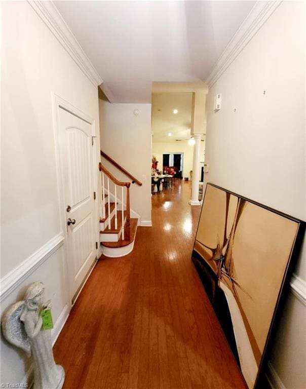 corridor featuring crown molding and wood-type flooring