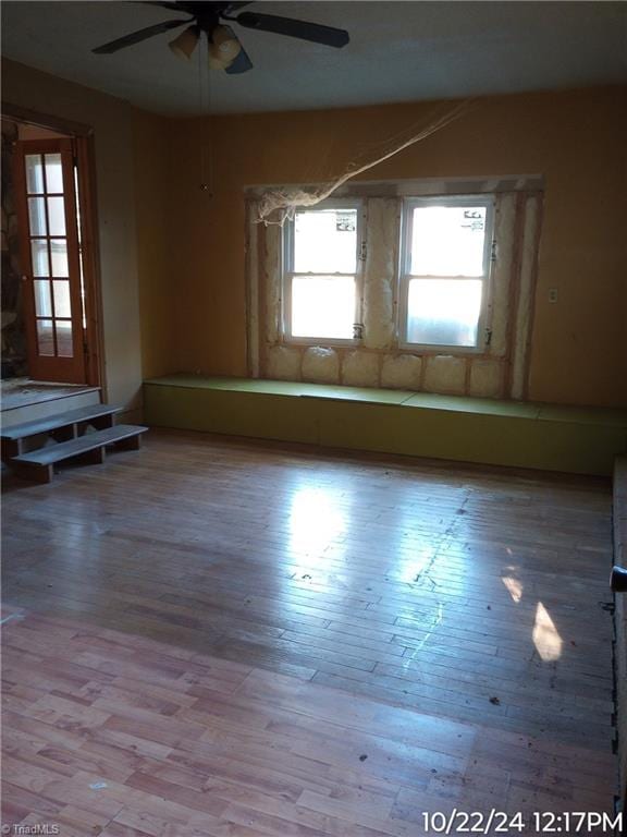 unfurnished room featuring ceiling fan and light hardwood / wood-style floors