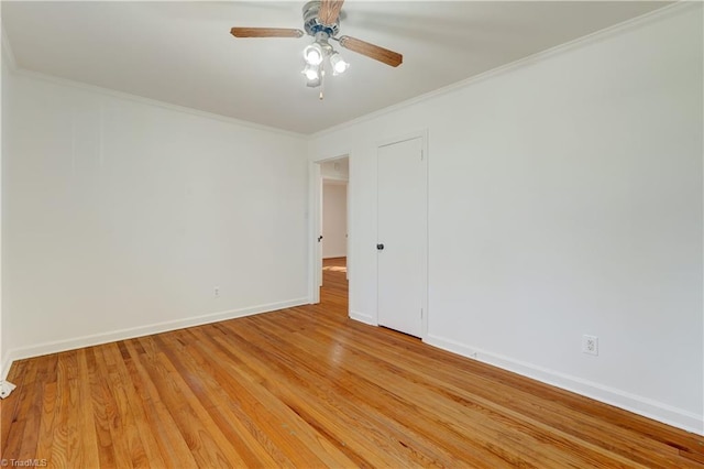 spare room featuring ceiling fan, crown molding, and light hardwood / wood-style flooring