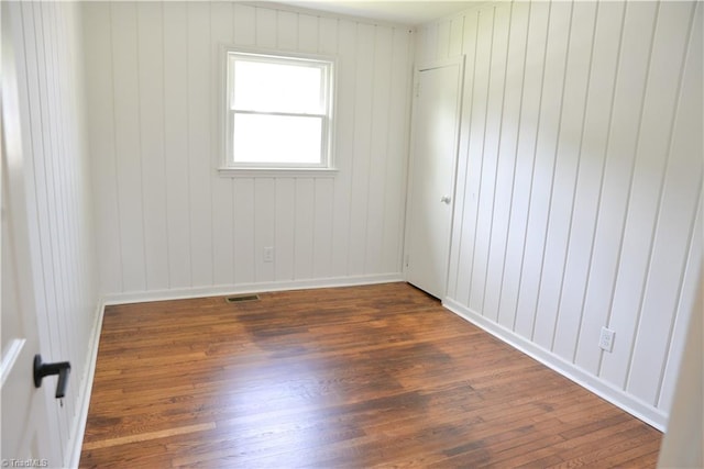 empty room featuring dark hardwood / wood-style floors