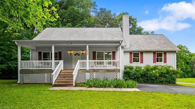 3602 Jeannie Rd, Whitsett, NC 27377 - view of front of property featuring a chimney, a front yard, covered porch, and stairway