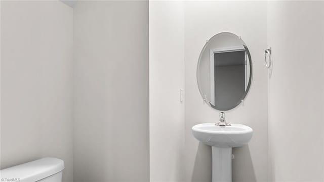 233 Lisa Ln, Winston-Salem, NC 27107 - half bathroom featuring toilet