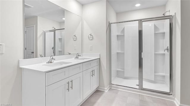 233 Lisa Ln, Winston-Salem, NC 27107 - full bath with a shower stall, baseboards, and double vanity