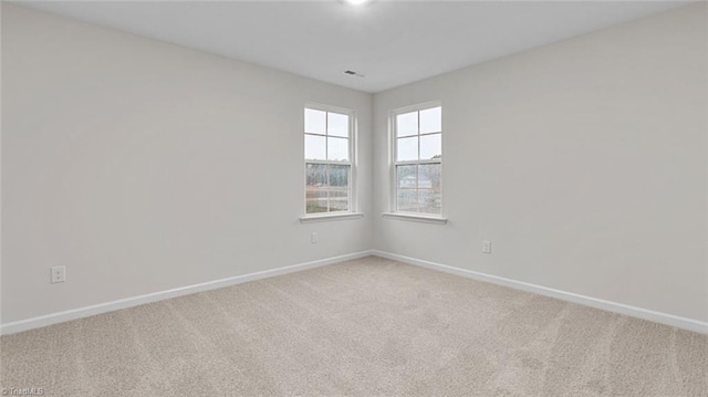 233 Lisa Ln, Winston-Salem, NC 27107 - spare room featuring light carpet and baseboards