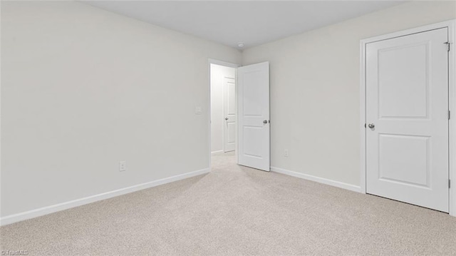 233 Lisa Ln, Winston-Salem, NC 27107 - unfurnished bedroom with light carpet and baseboards