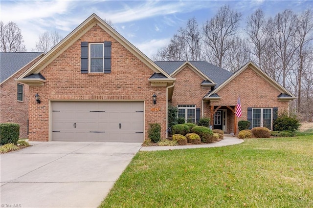 front of property with a front yard and a garage