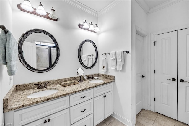 bathroom with tile patterned flooring, vanity, and ornamental molding