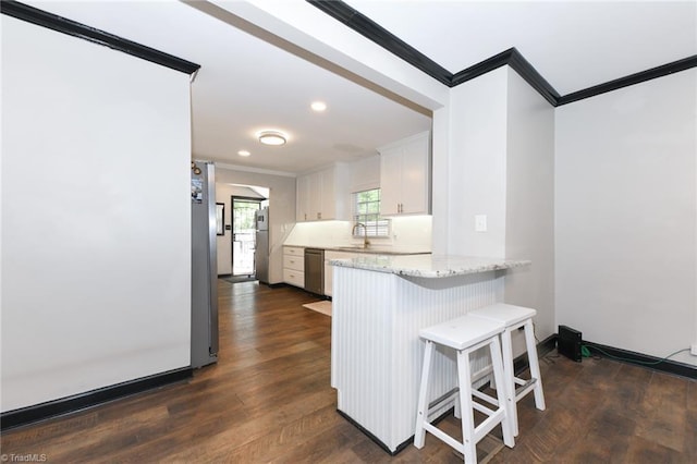 1449 NC Highway 150, Summerfield, NC 27358 - kitchen with crown molding, stainless steel appliances, a peninsula, a breakfast bar, and a sink