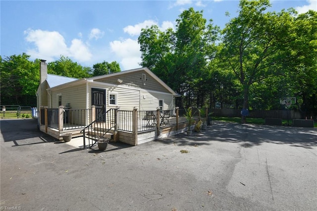1449 NC Highway 150, Summerfield, NC 27358 - view of front of property featuring a deck and a chimney