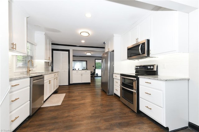 1449 NC Highway 150, Summerfield, NC 27358 - kitchen featuring stainless steel appliances, a sink, backsplash, white cabinets, and dark wood-style flooring