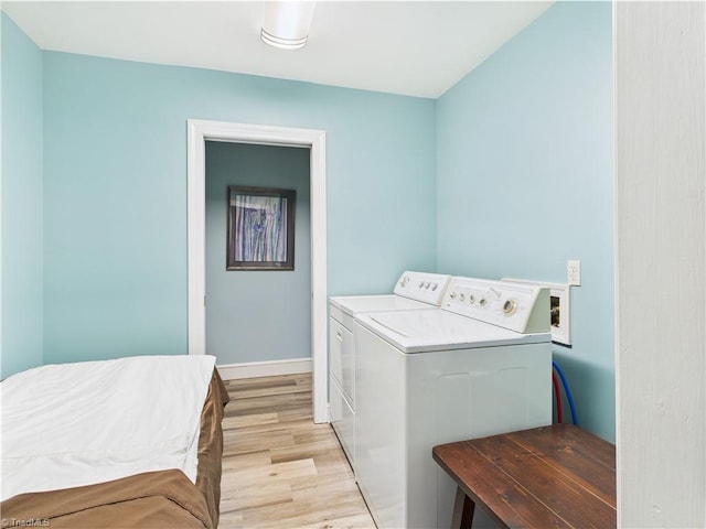 4208 Aberdare Dr, High Point, NC 27265 - laundry area featuring light wood-style flooring, washer and clothes dryer, and baseboards