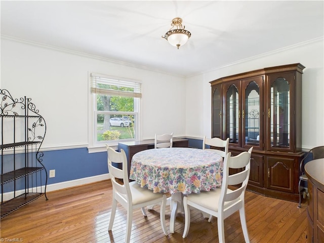 4208 Aberdare Dr, High Point, NC 27265 - dining space featuring light wood-style floors, crown molding, and baseboards