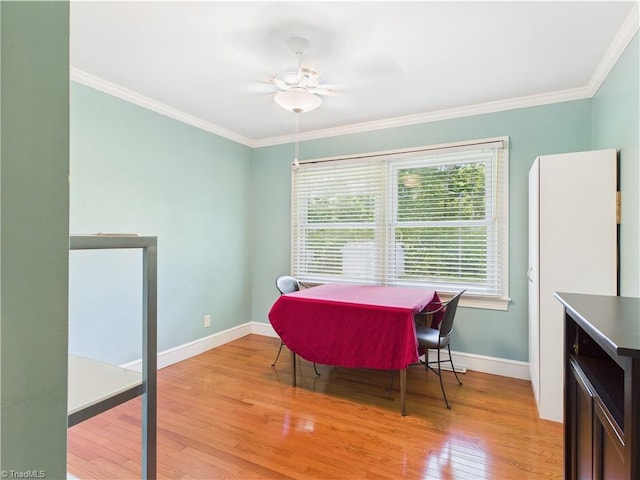 4208 Aberdare Dr, High Point, NC 27265 - dining room featuring healthy amount of natural light, light wood-style flooring, ornamental molding, baseboards, and a ceiling fan