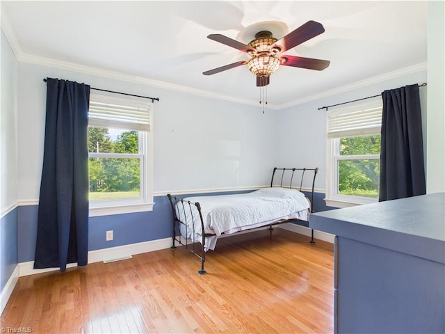 4208 Aberdare Dr, High Point, NC 27265 - bedroom with baseboards, light wood-style flooring, crown molding, and ceiling fan