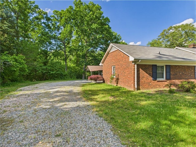 4208 Aberdare Dr, High Point, NC 27265 - view of side of home featuring gravel driveway and brick siding