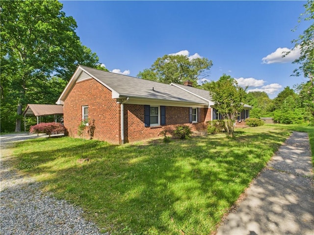 4208 Aberdare Dr, High Point, NC 27265 - view of side of home with brick siding, a lawn, and a chimney